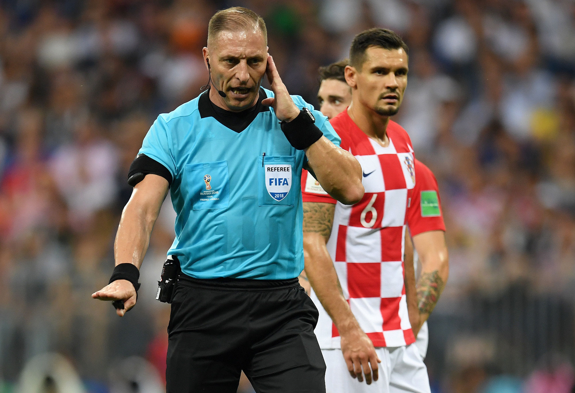 Referee Nestor Pinata consults VAR during the World Cup.
