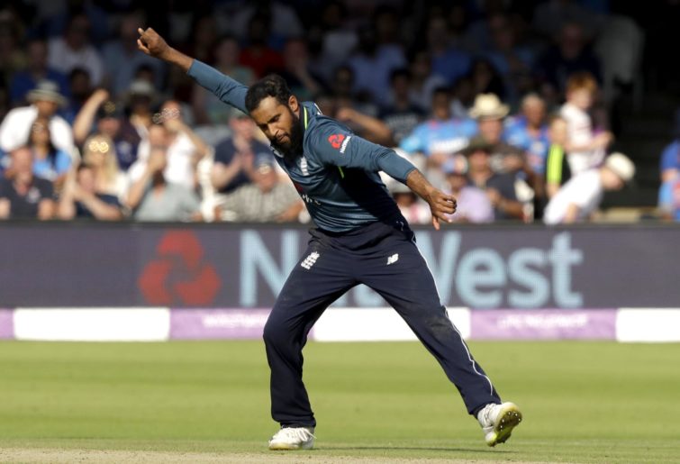England's Adil Rashid celebrates taking the wicket of India's Suresh Raina during the one day cricket match between England and India at Lord's cricket ground in London, Saturday, July 14, 2018. (AP Photo/Matt Dunham)