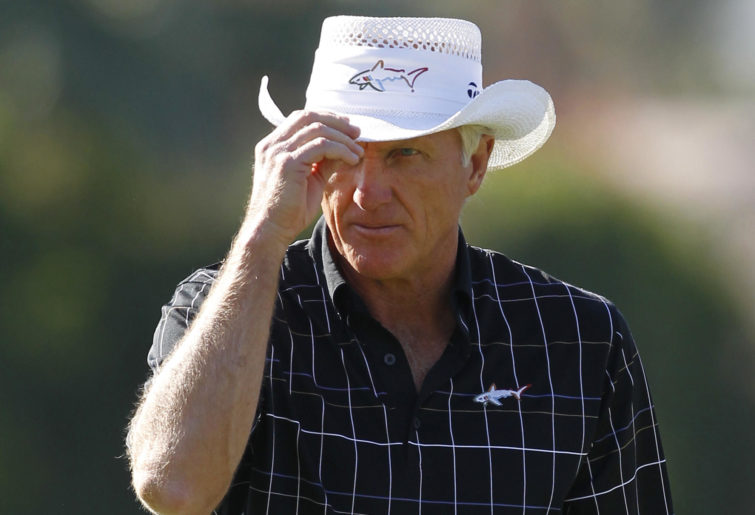 Greg Norman tips his hat