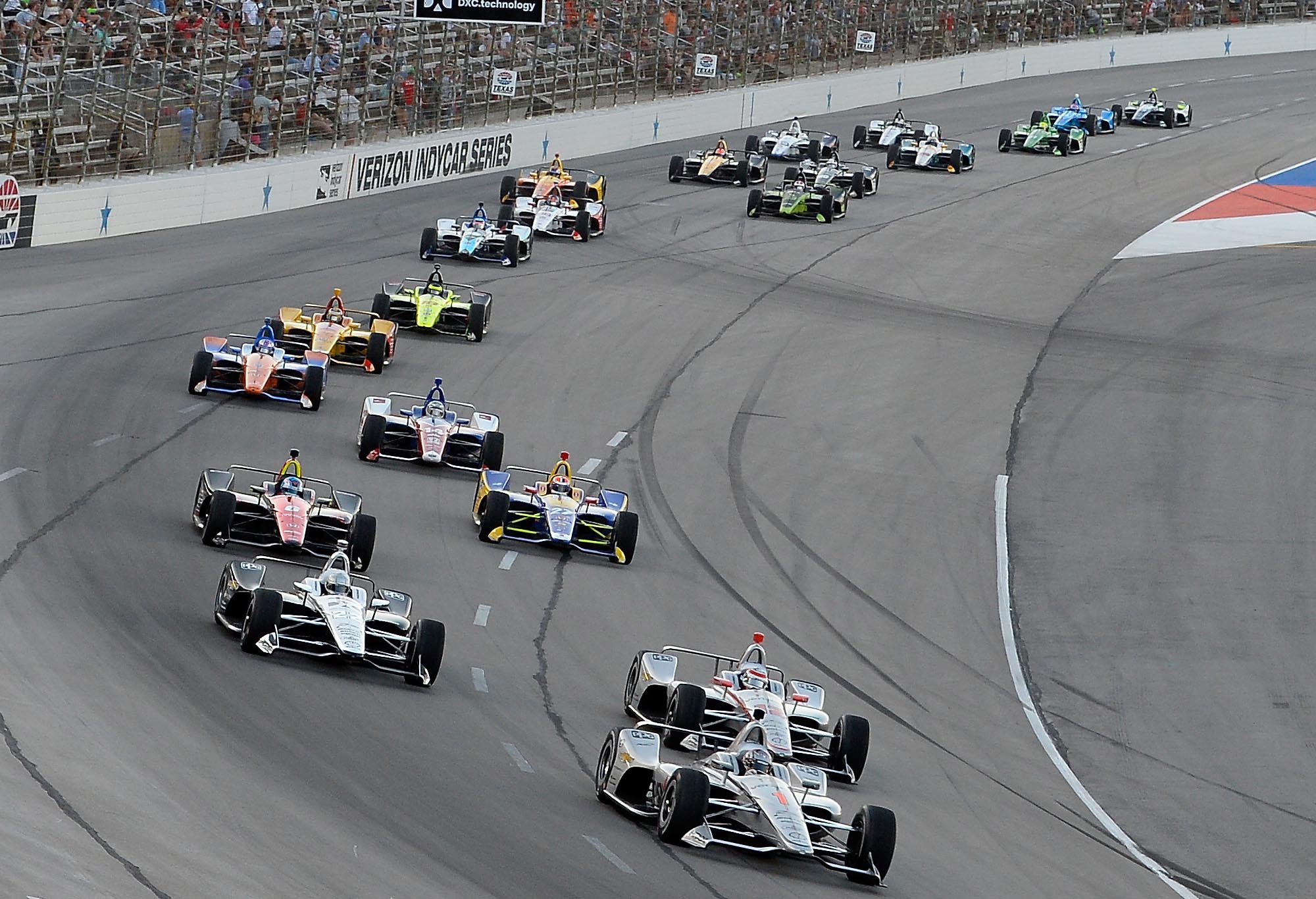 Josef Newgarden, driver of the #1 Verizon Team Penske Chevrolet, leads a pack of cars at Texas Motor Speedway