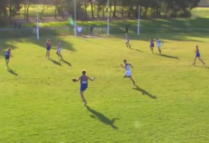Youngster dobs an absolute pearler from outside 50, hits goal ump in the groin