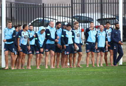 Blues players take part in a drill in bare feet