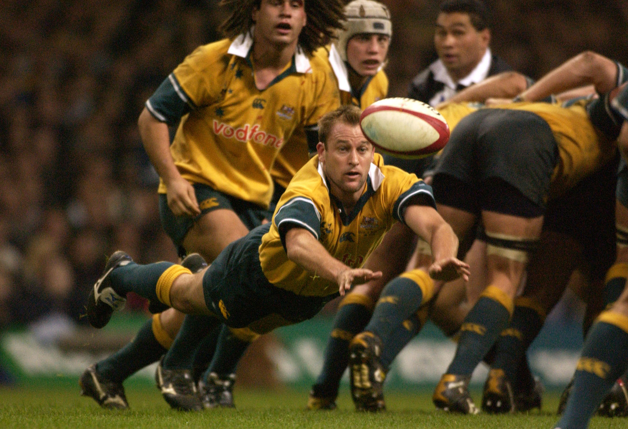 Chris Whitaker of the Wallabies passes the ball out from a scrum during a Test match.