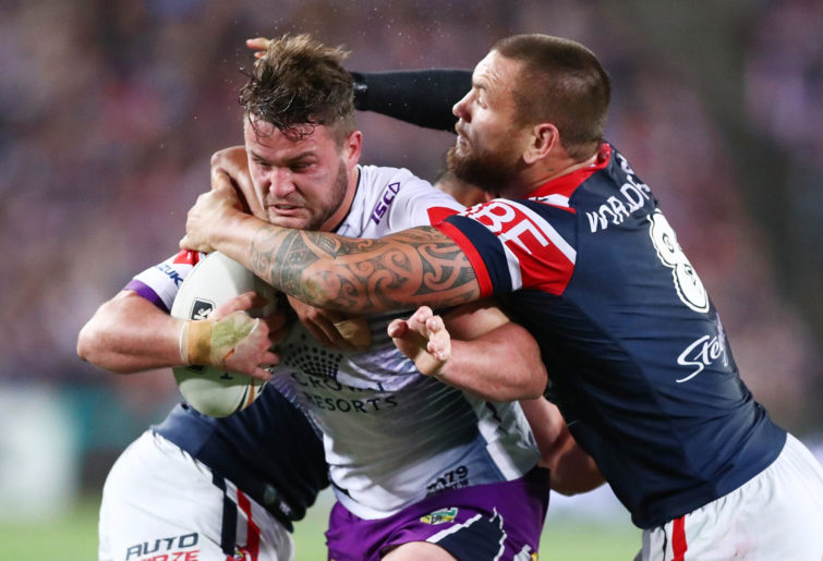 Joe Stimson of the Storm is tackled during the 2018 NRL Grand Final.