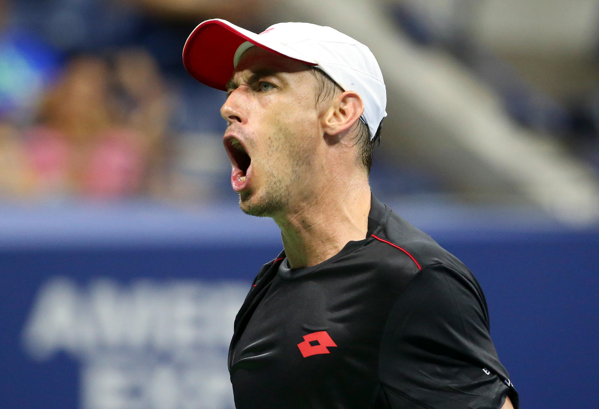 John Millman celebrates during his victory over Roger Federer at the 2018 US Open.