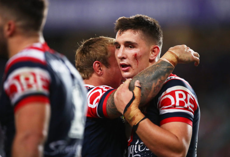 Victor Radley of the Roosters celebrates victory with Jake Friend of the Roosters.