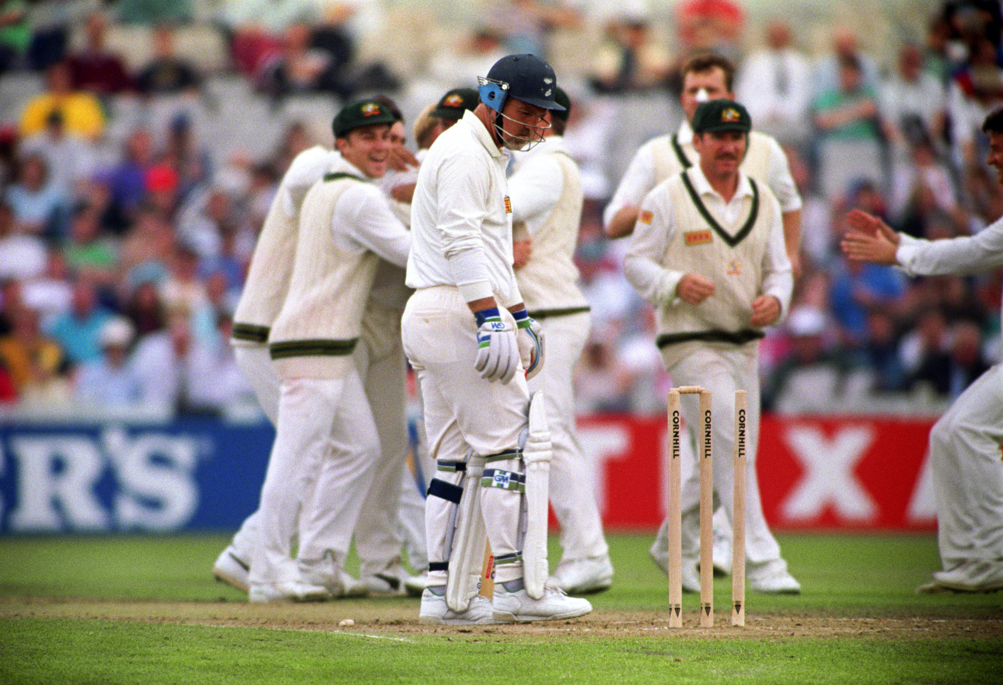 England's Mike Gatting (centre) is bowled out by Shane Warne