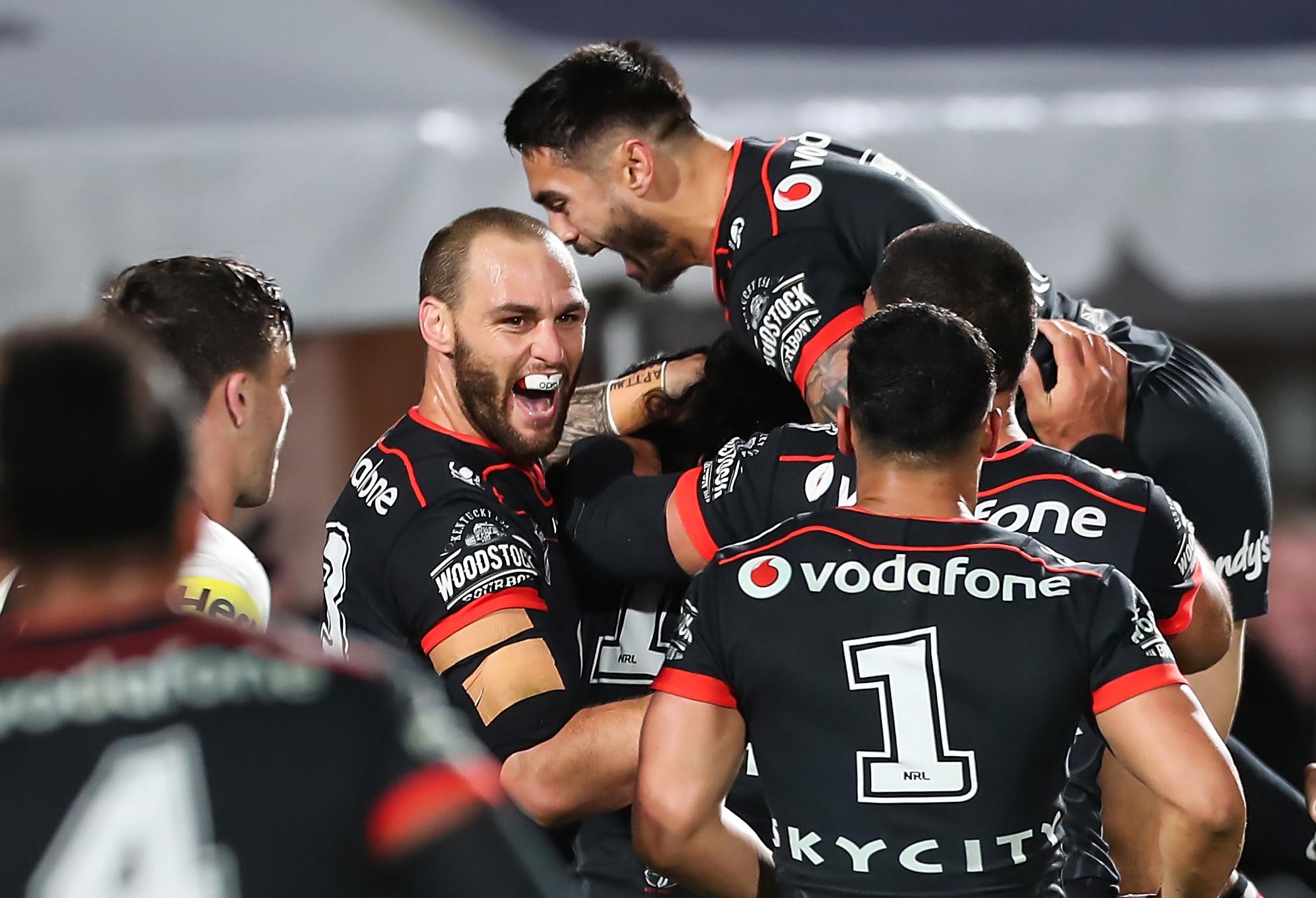 Simon Mannering celebrates with Shaun Johnson during the Warriors' win over Penrith.