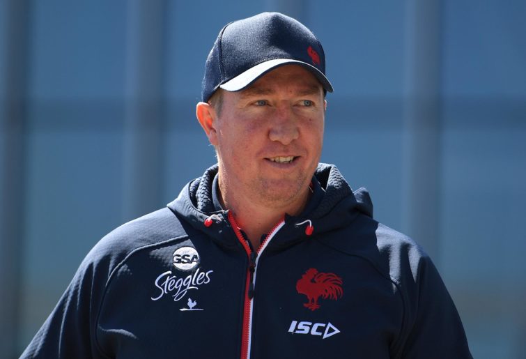Sydney Roosters coach Trent Robinson arrives to address media during a press conference in Sydney