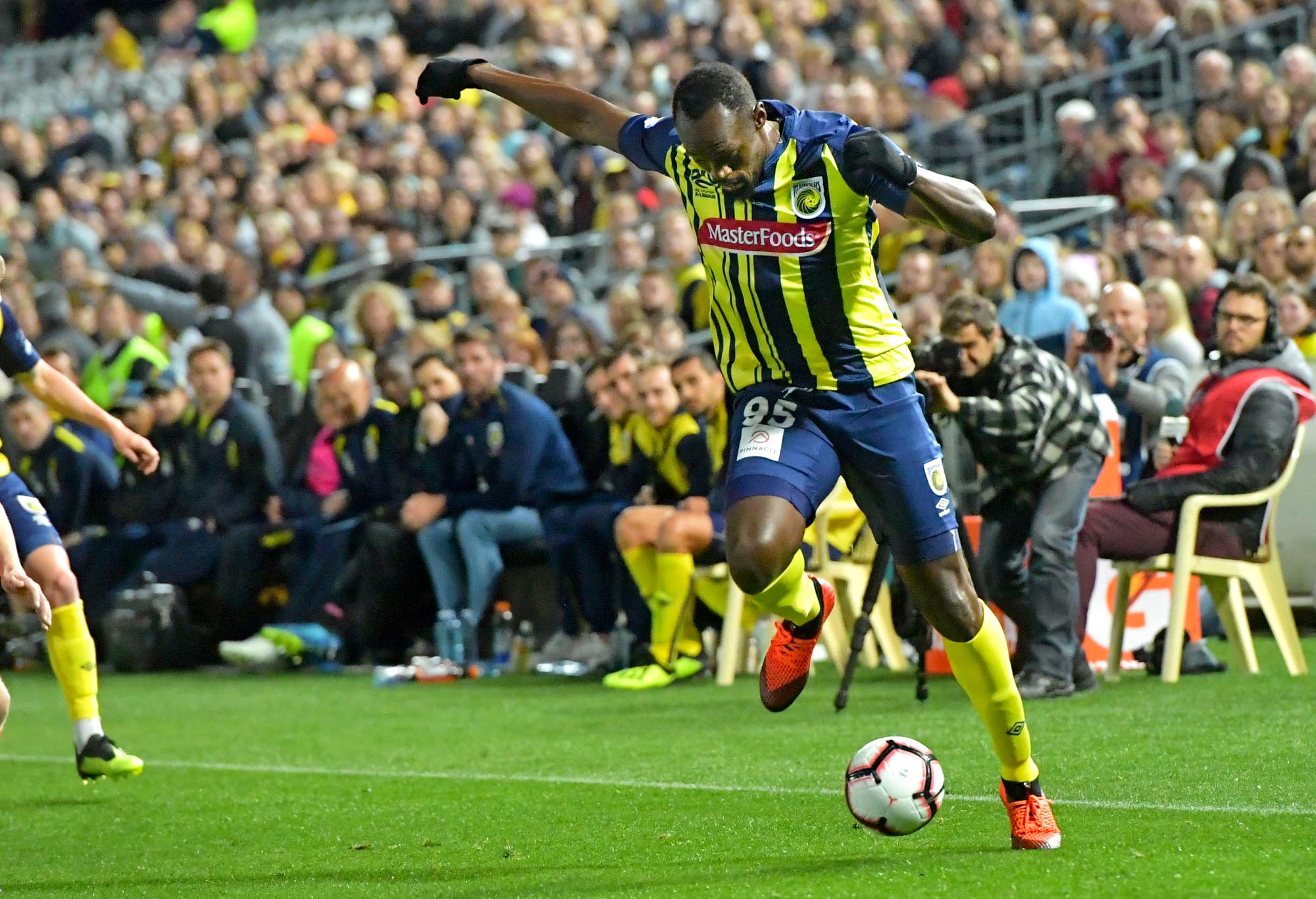 Usain Bolt controls the ball in his Central Coast Mariners debut.