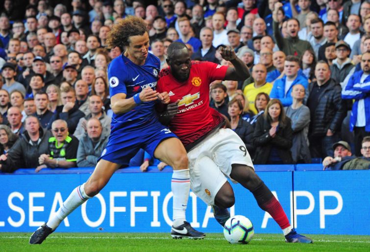 Romelu Lukaku and David Luiz battle for the ball