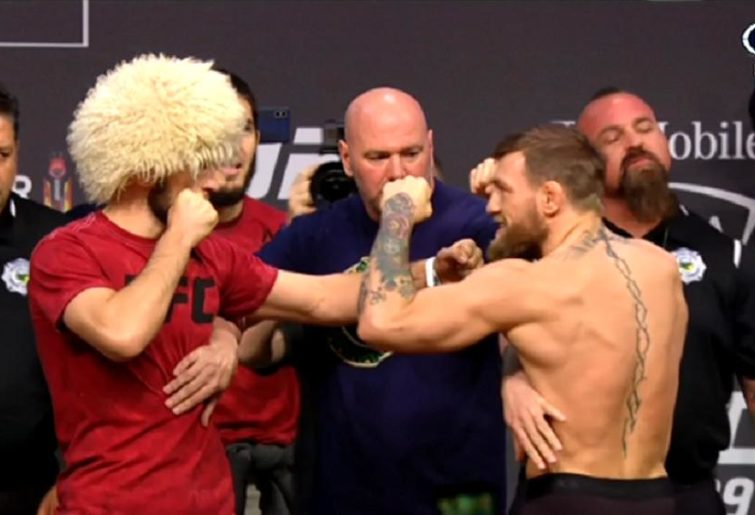 Conor McGregor throws a wild kick during fiery weigh-in