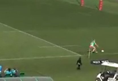Fullback makes abysmal mistake trying to pick up bouncing ball