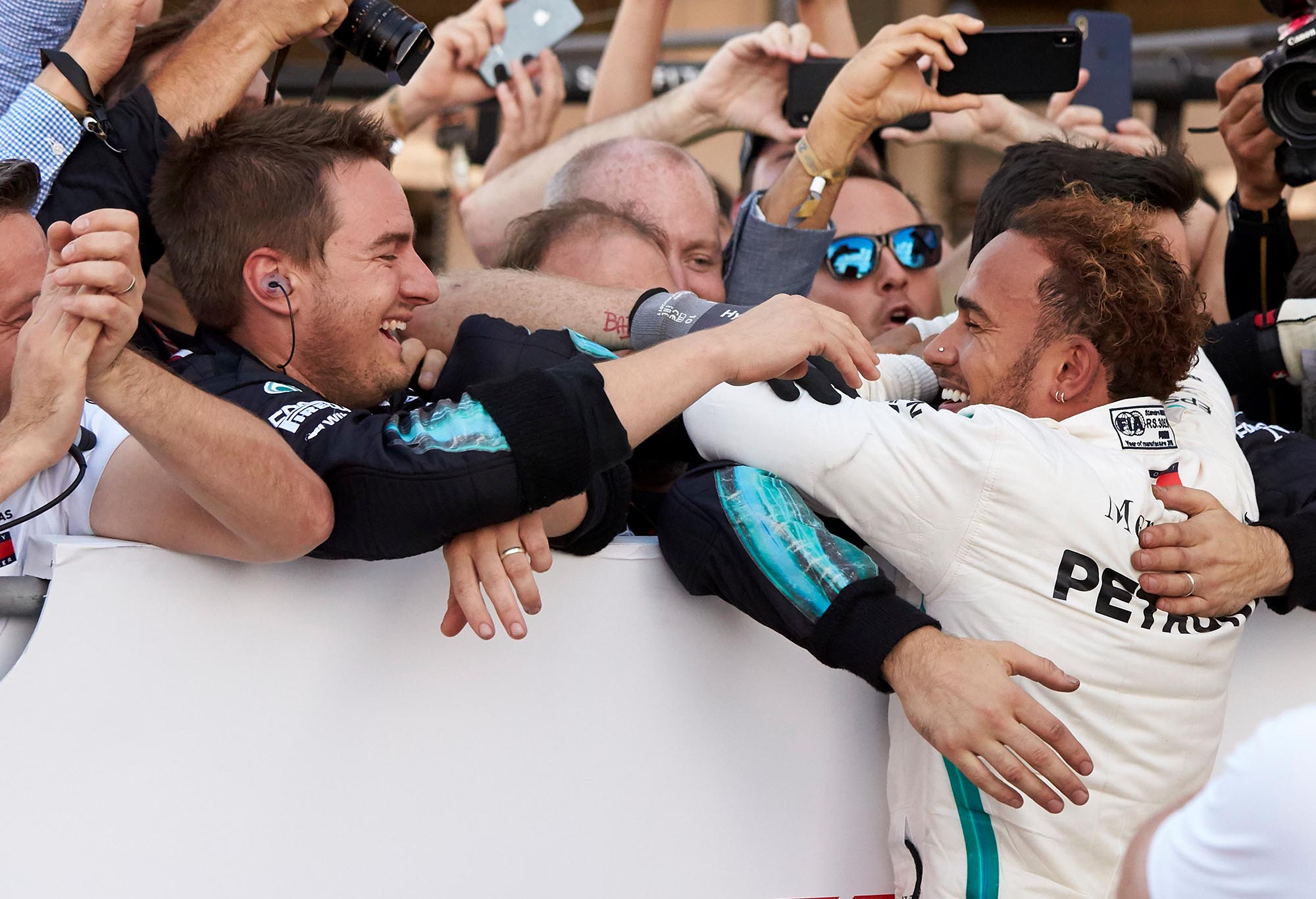 Lewis Hamilton celebrates victory in Japan with his Mercedes team.