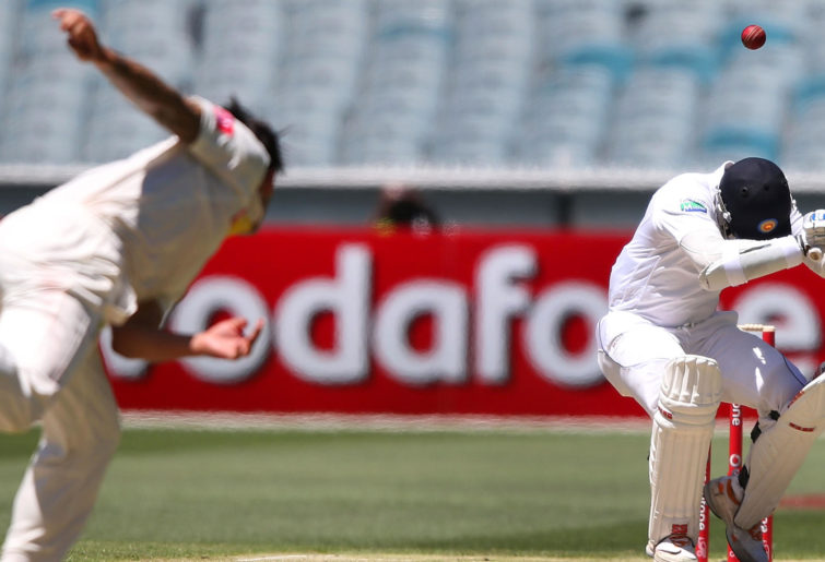 Mitchell Johnson of Australia bowls a bouncer to Kumar Sangakkara
