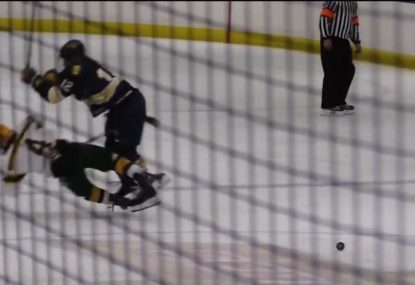 Highschool hockey player gets flattened by unexpected collision