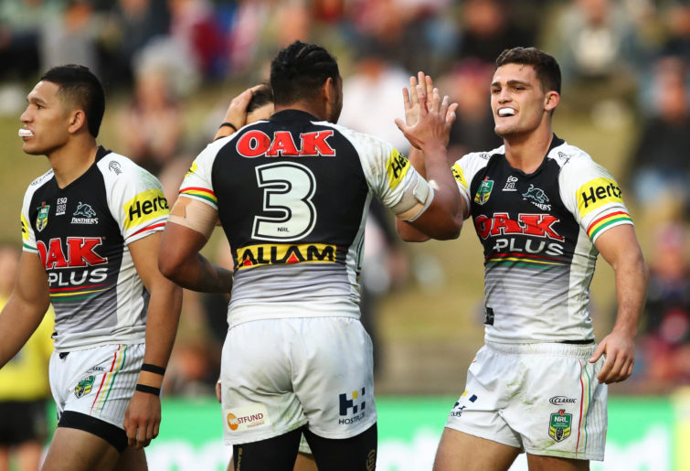 Nathan Cleary of the Panthers celebrates with team mates after scoring a try.