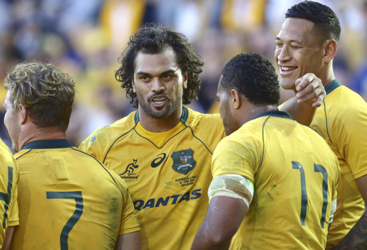Karmichael Hunt in a huddle with the Wallabies