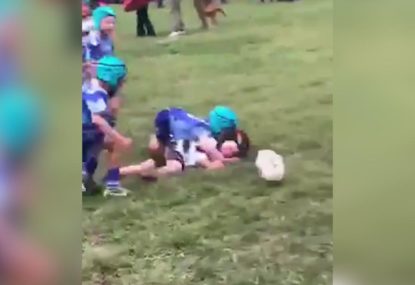 Under 6s debutant obliterates his opponent in one-on-one tackle