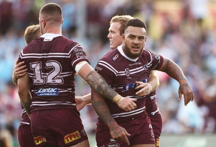 Manly Sea Eagles players celebrate a try.