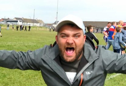 Supporters go absolutely nuts on the sideline after victory