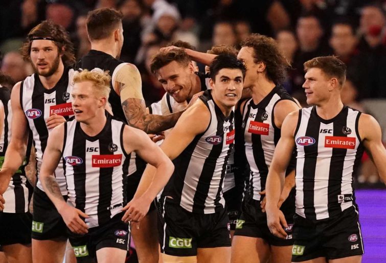 The Magpies celebrate