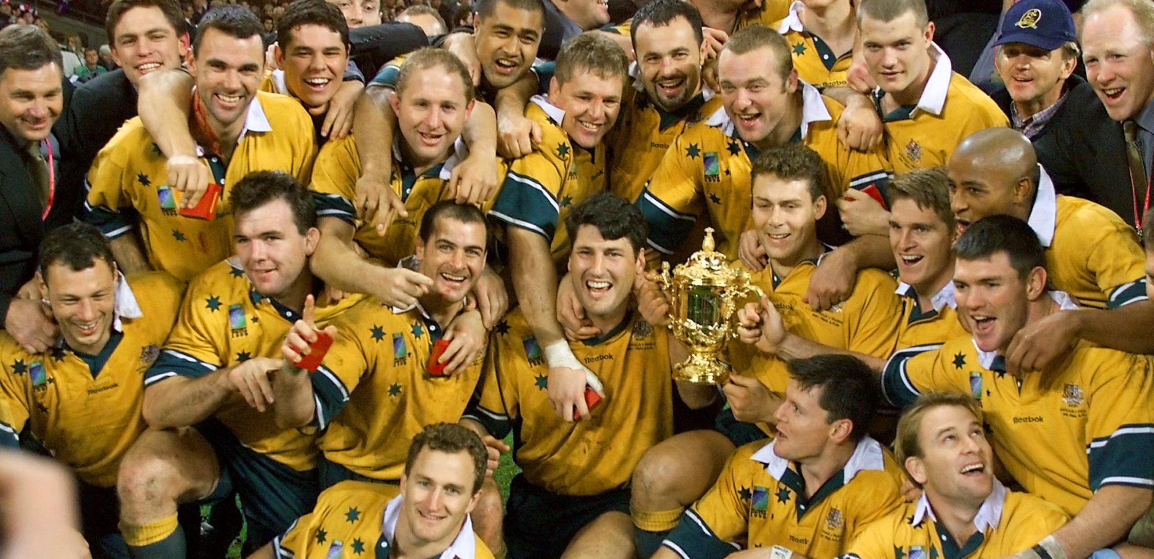 Australian players pose with the Webb Ellis Cup