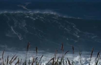 Surfer escapes with minor injury from 60ft wave wipeout
