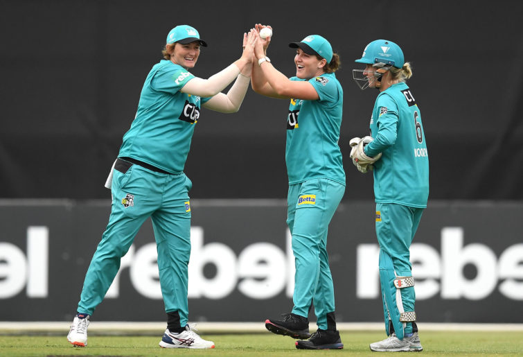 The Heat celebrate a wicket during the Women's Big Bash League