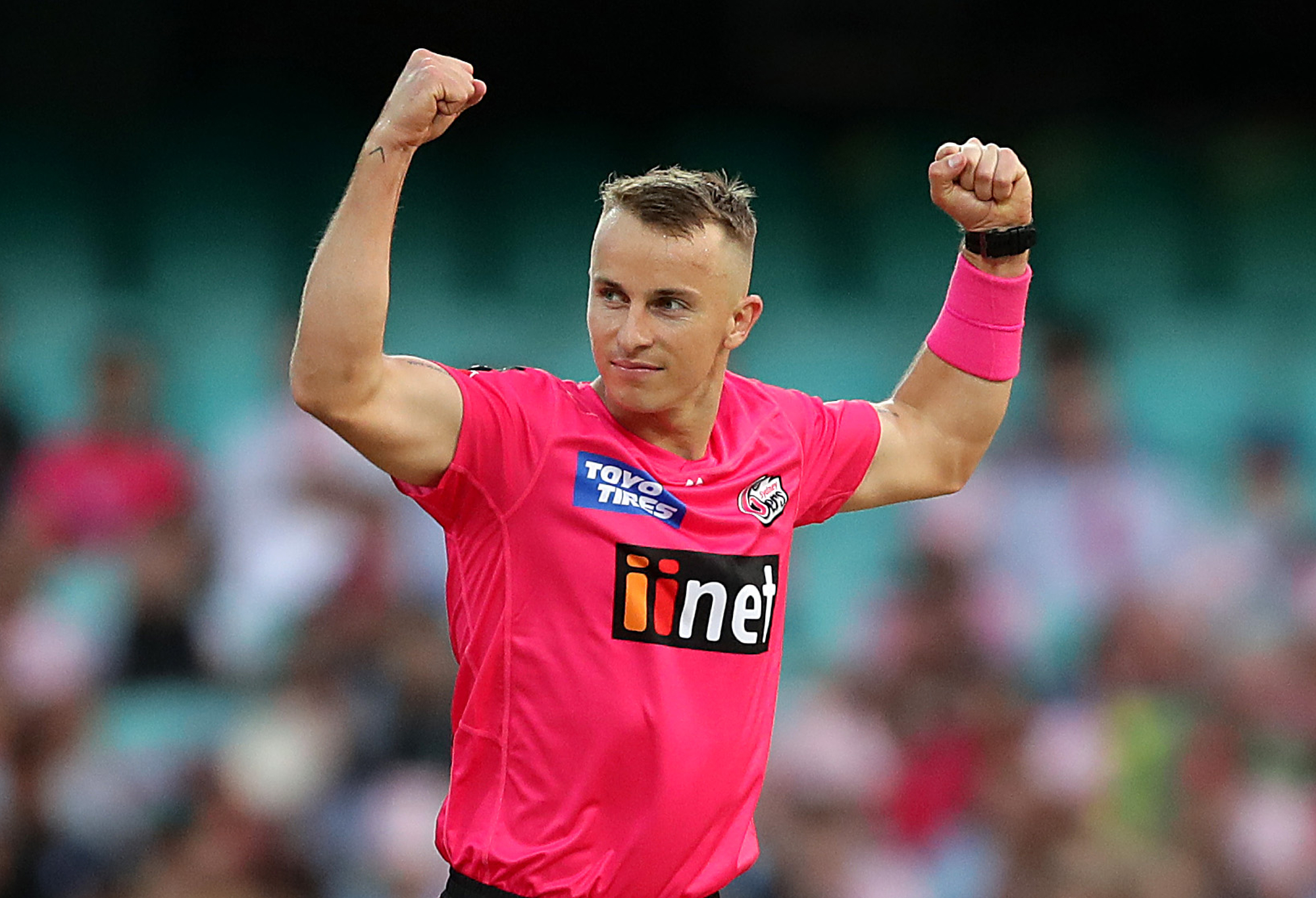Tom Curran of the Sixers celebrates taking a wicket