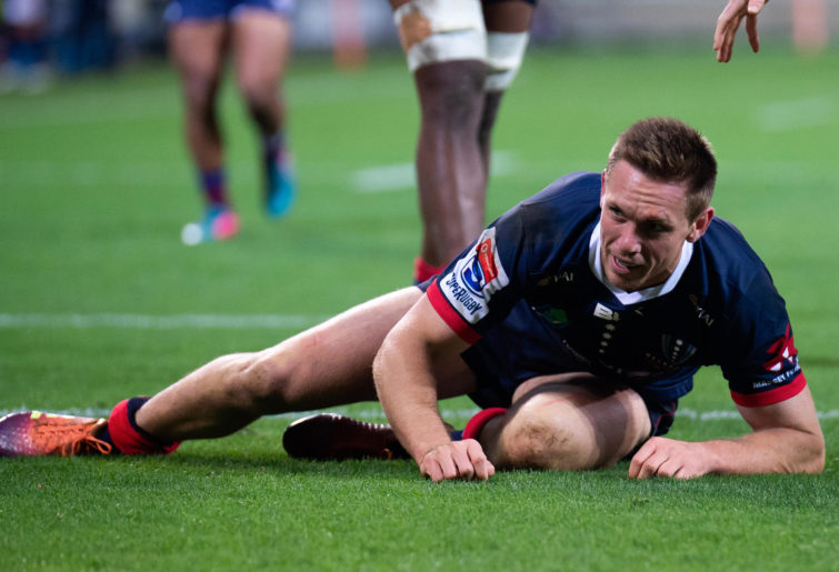 Dane Haylett-Petty of the Rebels looks on as he scores a try