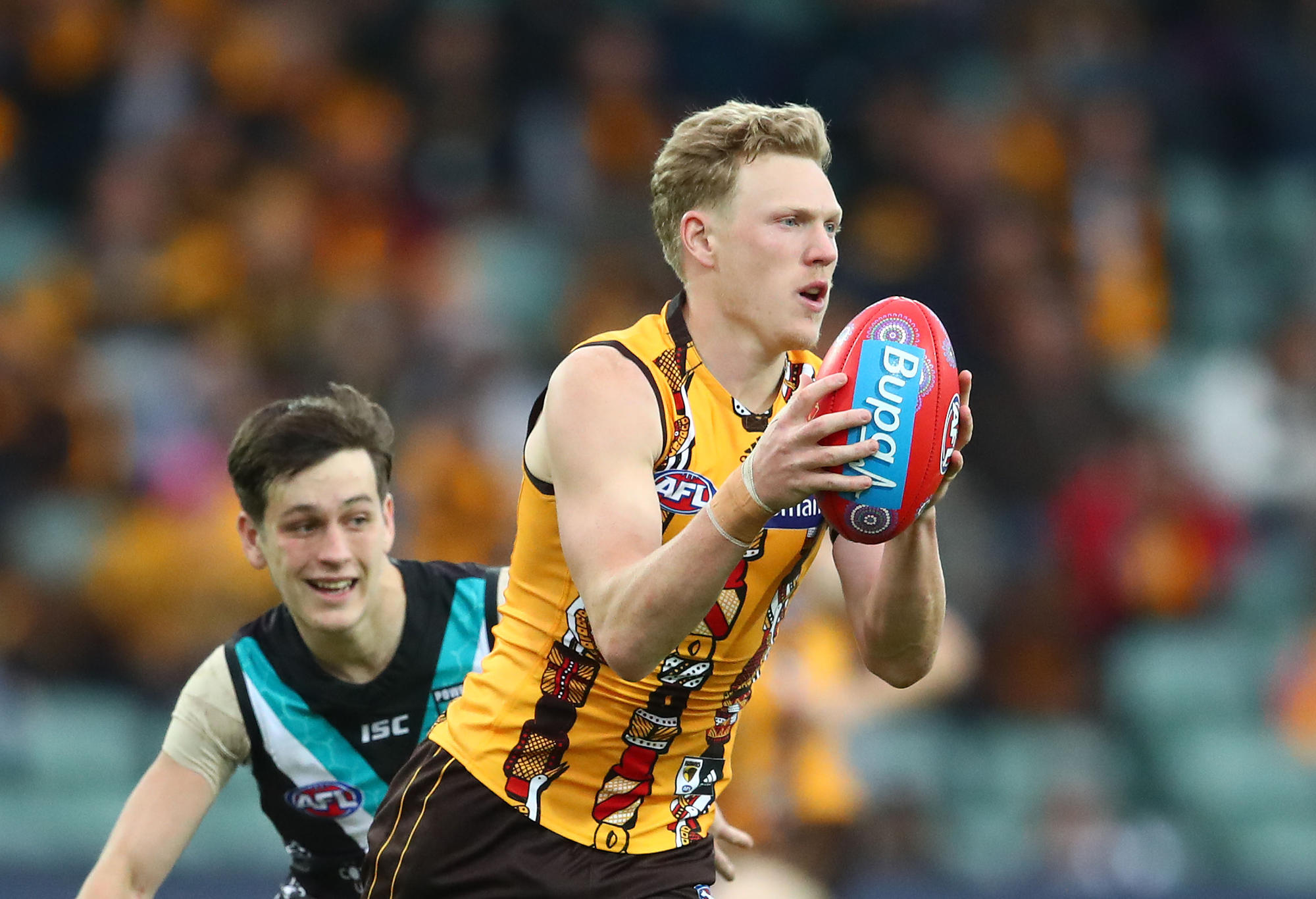 James Sicily of the Hawks runs with the ball