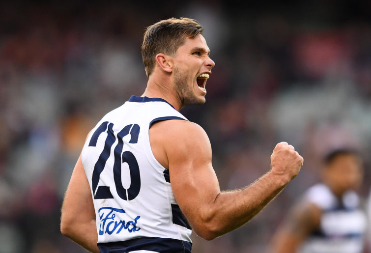 Tom Hawkins of the Cats celebrates kicking a goal