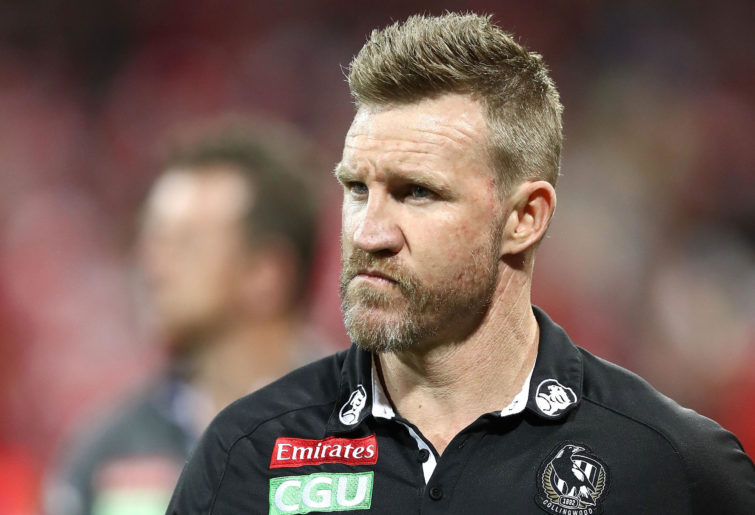 Nathan Buckley, coach of the Magpies, looks dejected