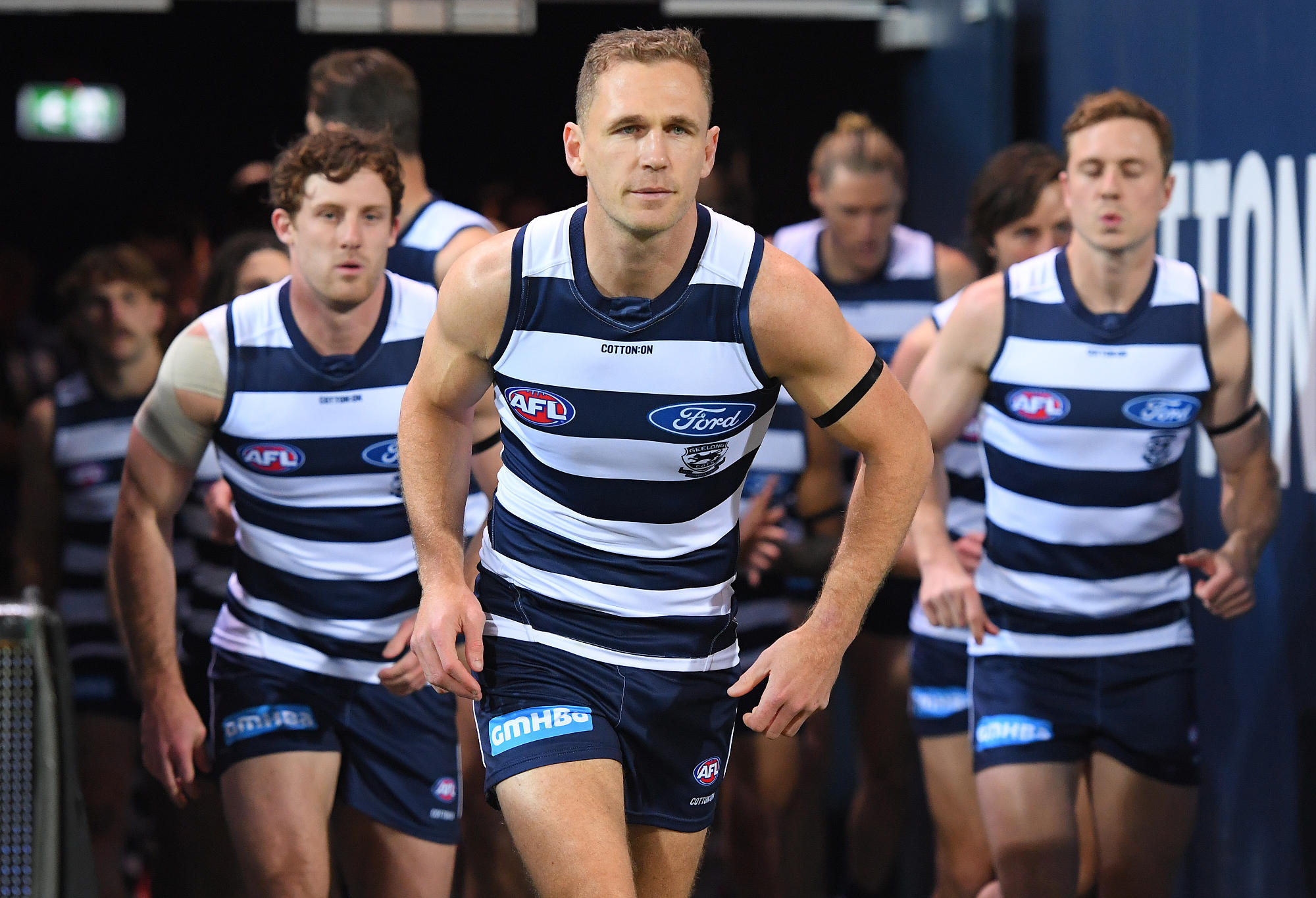 Joel Selwood of the Cats leads his team out onto the field