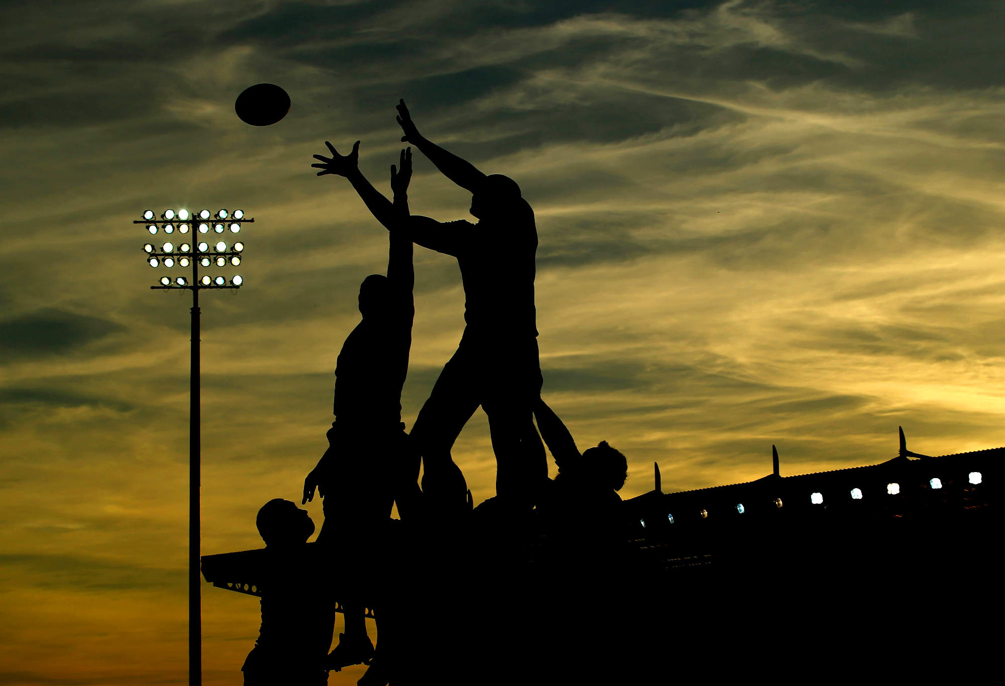 A general view of a lineout at sunset