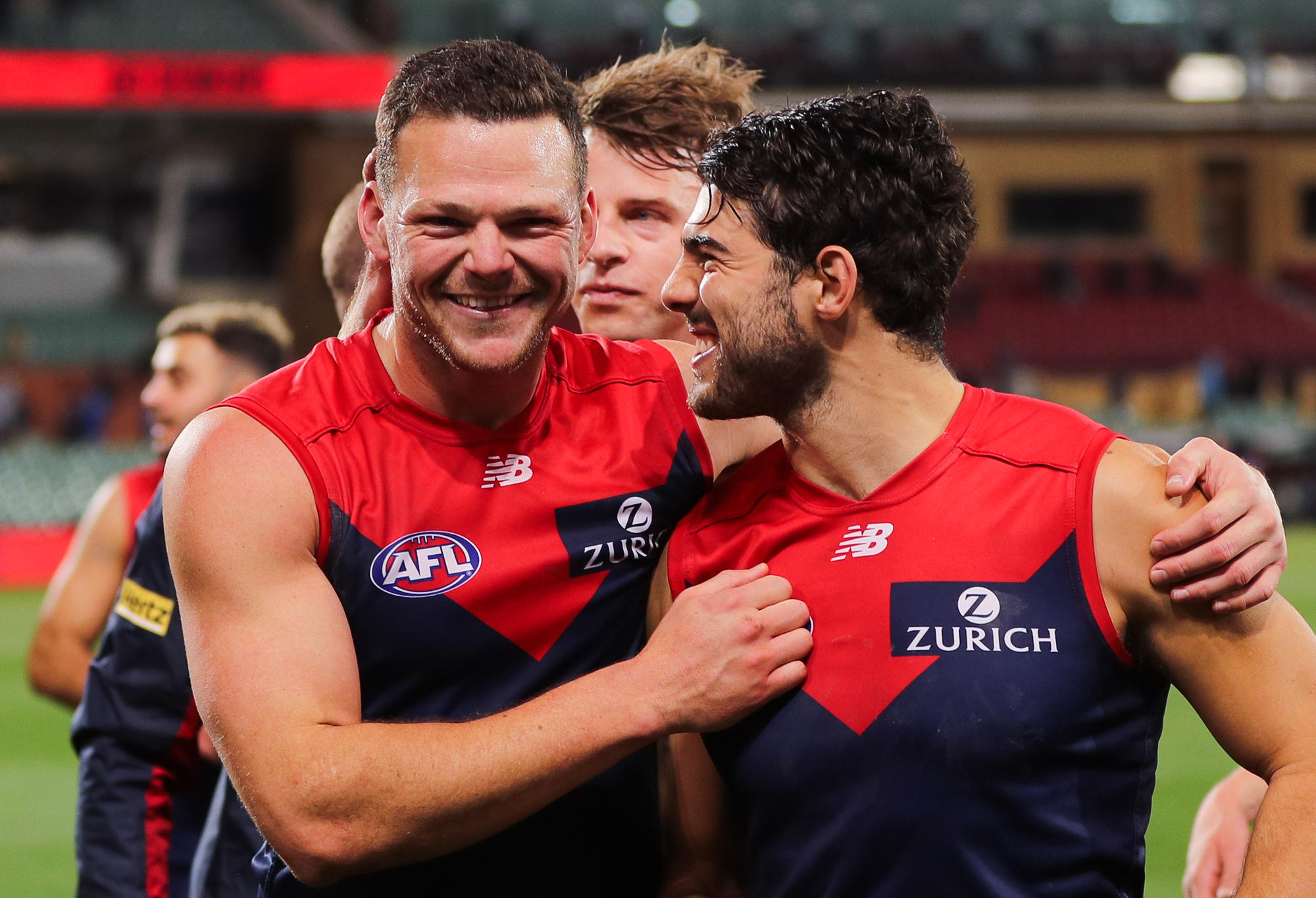Steven May and Christian Petracca of the Demons celebrate victory