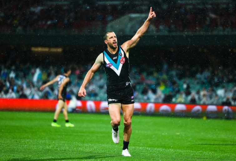 Travis Boak of the Power celebrates after kicking a goal
