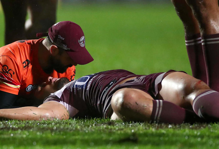 Martin Taupau of the Sea Eagles receives attention