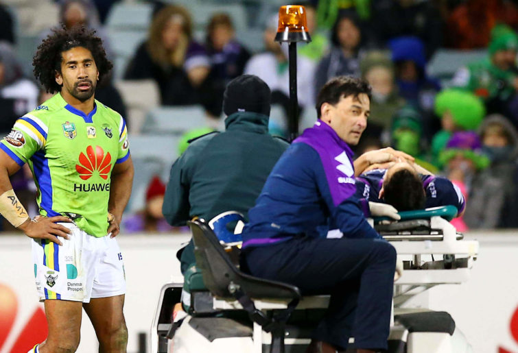 Billy Slater is taken off after a tackle by Iosia Soliola