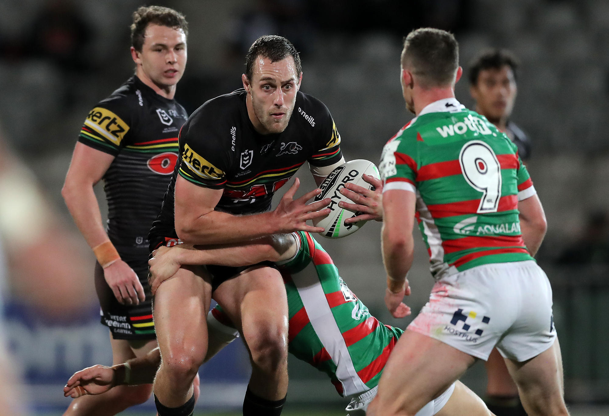 Isaah Yeo of the Panthers is tackled