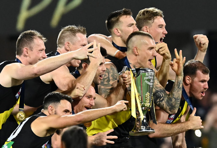 The Tigers celebrate with the premiership cup after winning the 2020 AFL Grand Final