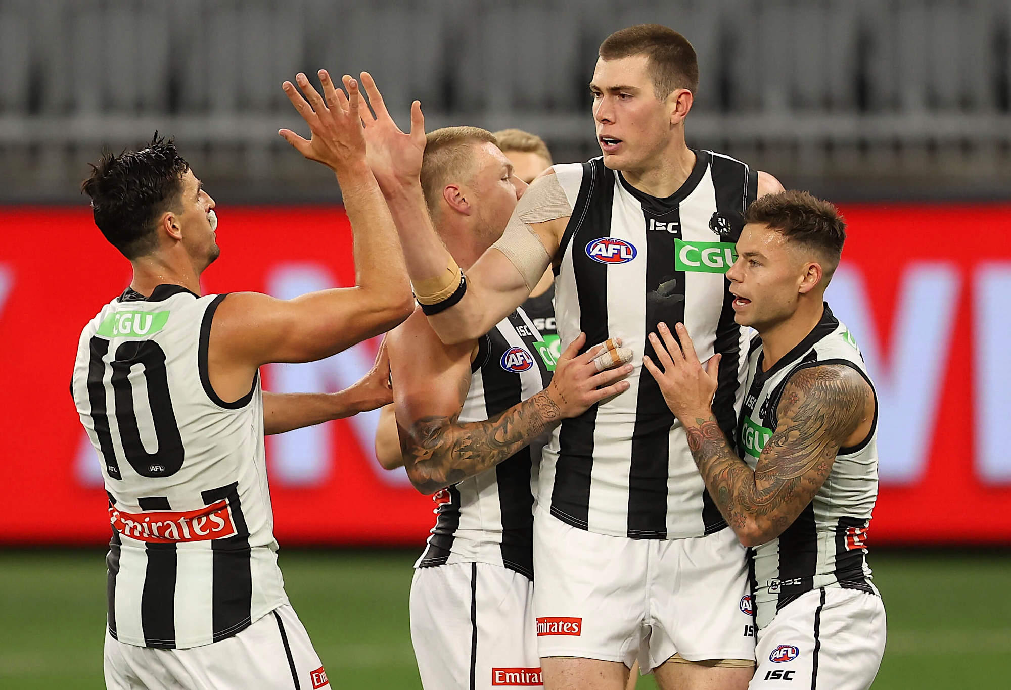 Mason Cox and the Magpies celebrate