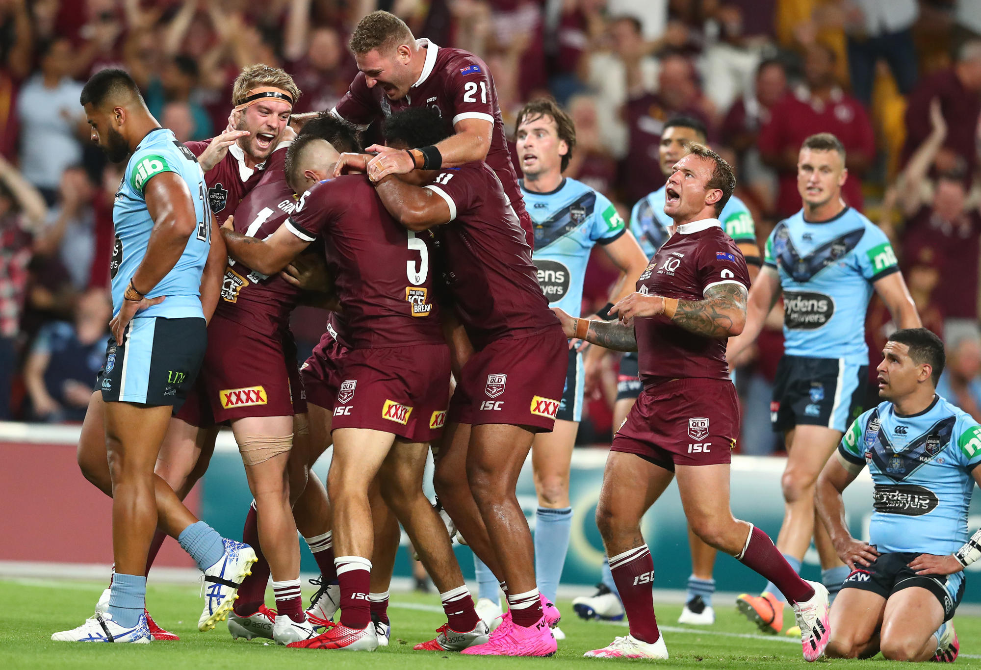 Maroons celebrate a try by Harry Grant during game three of the State of Origin series