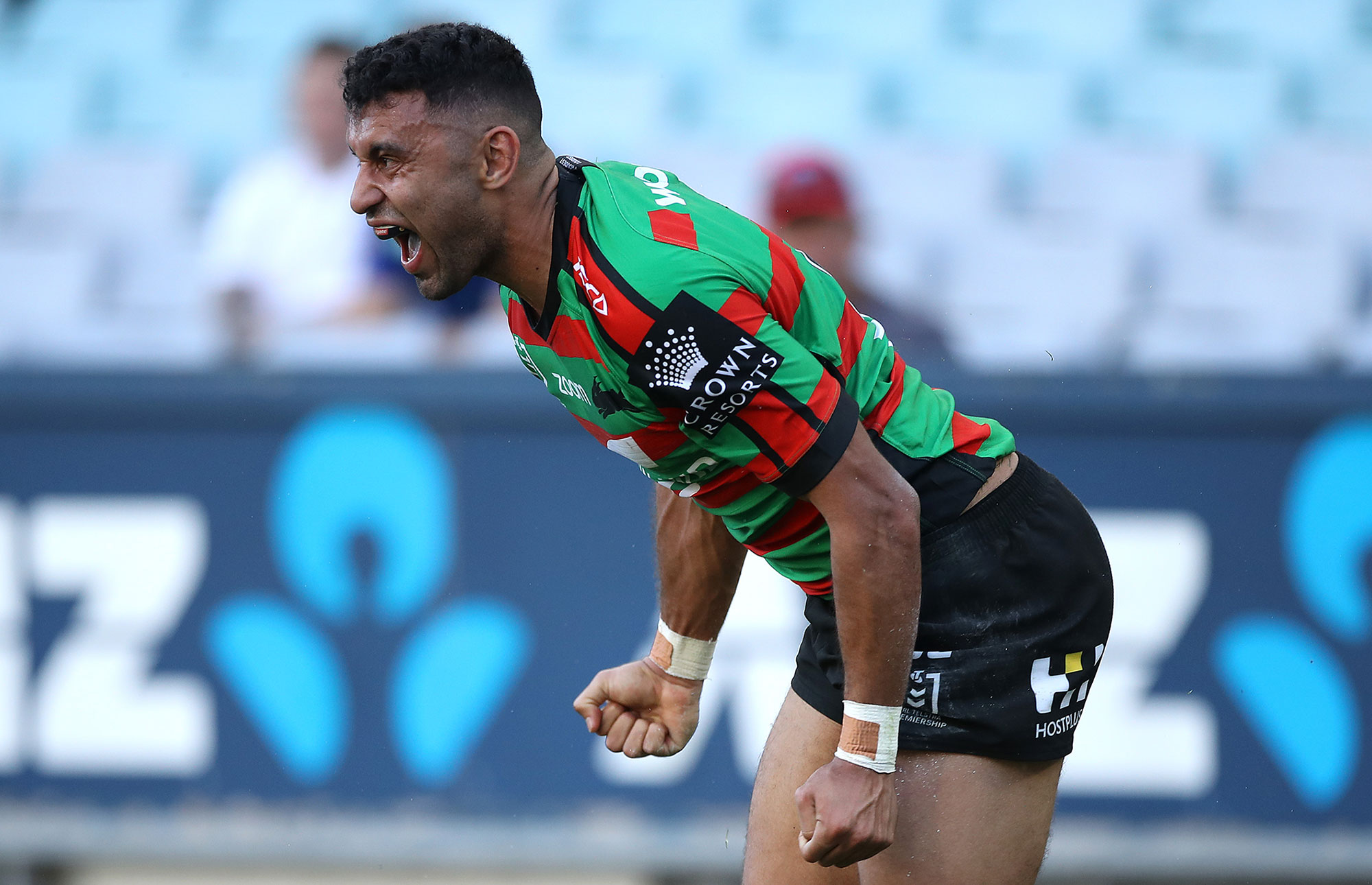 Alex Johnston of the Rabbitohs celebrates after scoring a try