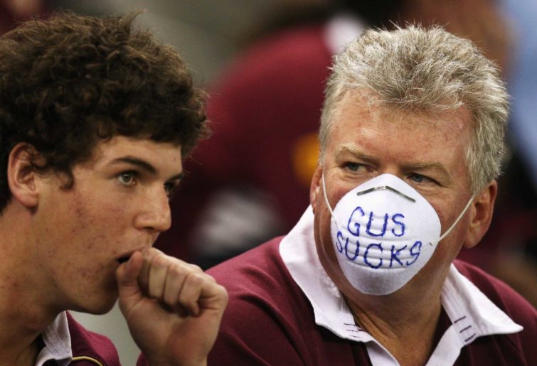 A Maroons fan sends his message on his mask to Phil Gould