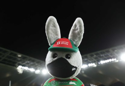 The Rabbitohs mascot is seen wearing a mask