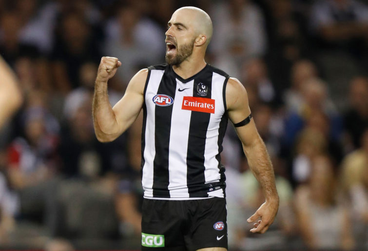 Steele Sidebottom of the Magpies celebrates a goal
