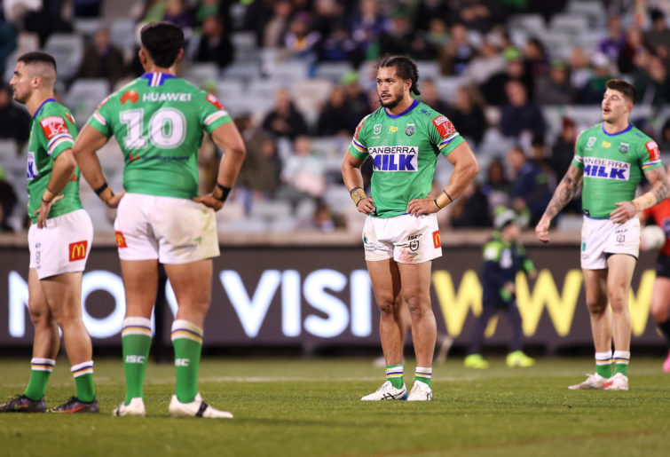 Corey Harawira-Naera of the Raiders and his team mates look dejected after defeat.
