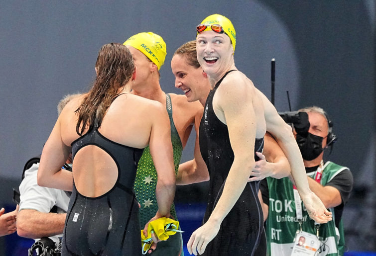 The relay team from Australia cheers for gold.